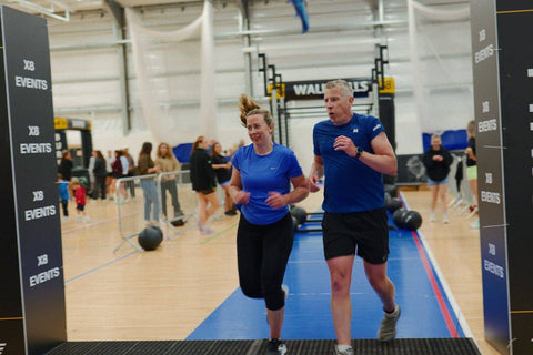 Athletes crossing the finish line at the Juice Jar HYROX Full Simulation, Newforge Sports Complex, Belfast, June 2026