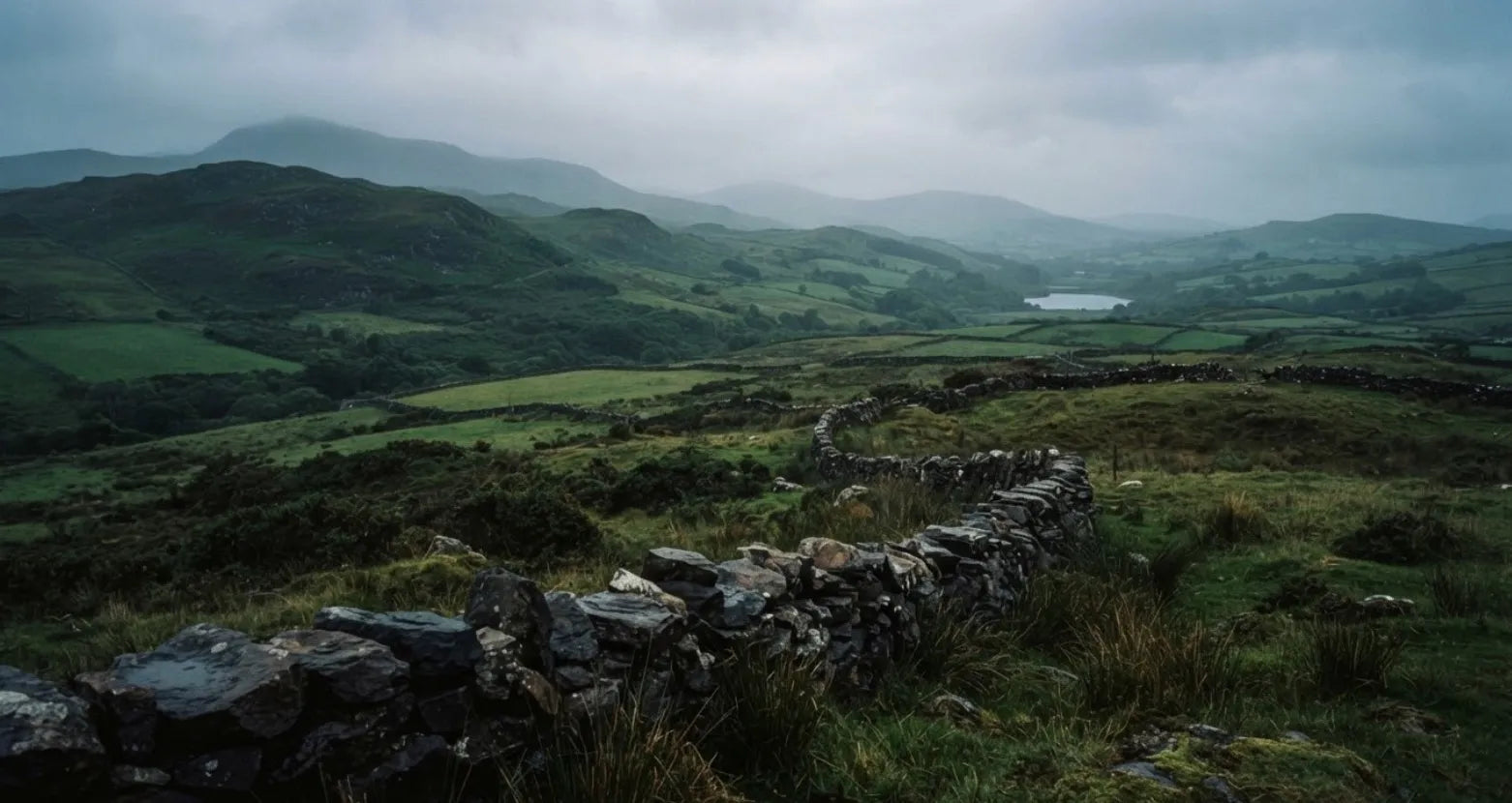 Moody green hills and dry stone walls in the Irish countryside